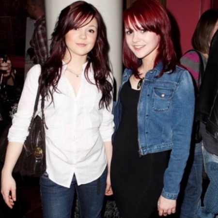 Kathryn Prescott with her twin sister Megan Prescott.
